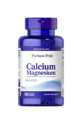 Puritan's Pride Calcium Magnesium supplement bottle with 100 caplets for bone health and muscle support.